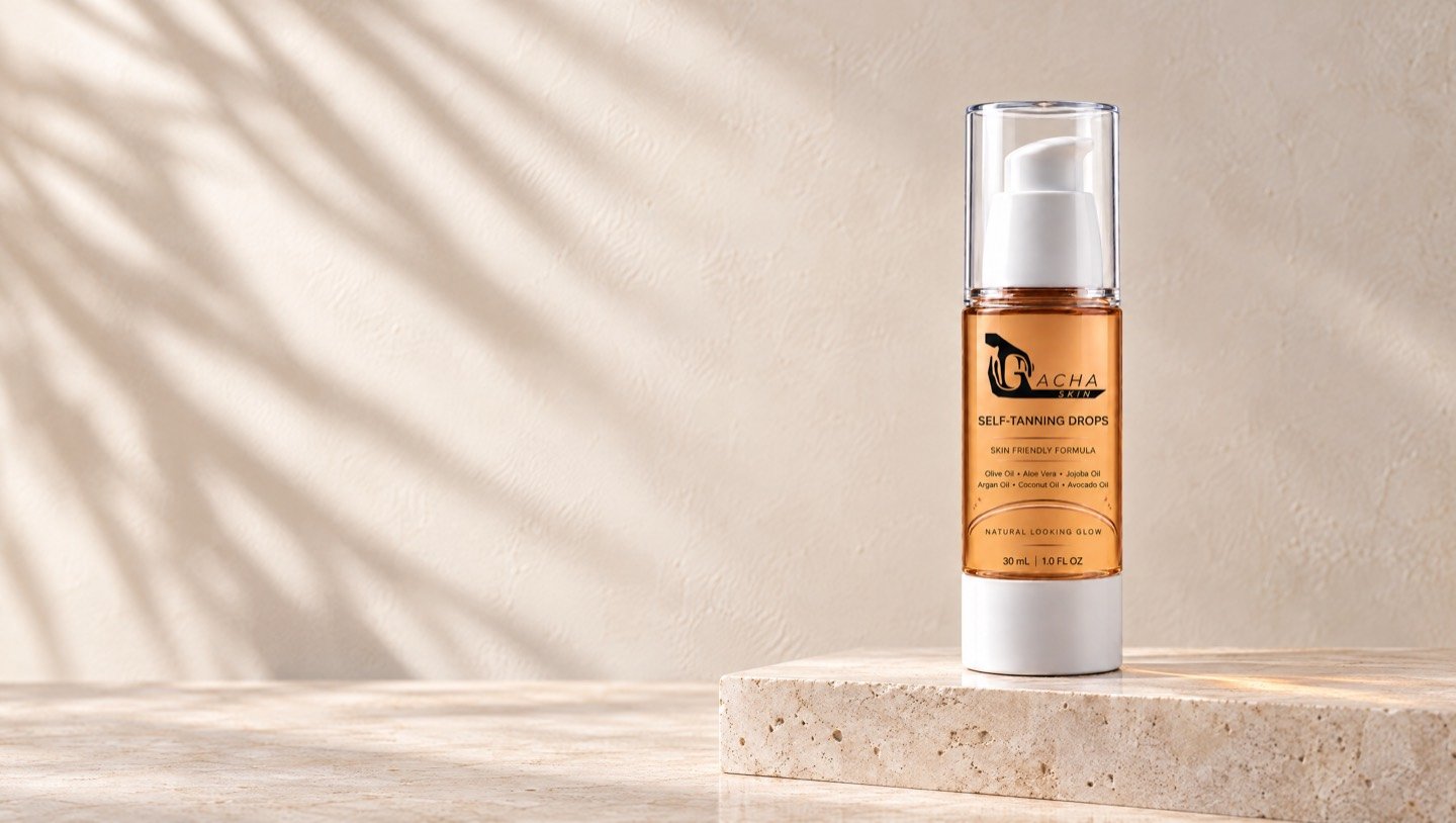 The Gacha Skin Self-Tanning Drops bottle, amber with a clear cap and white pump, standing on a travertine plinth while soft palm shadows fall across a pale plaster wall.